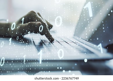 Double exposure of creative abstract binary code hologram and hands typing on laptop on background. Database and programming concept
