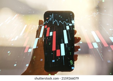 Double exposure of creative abstract global crisis chart with world map hologram and hand with cell phone on background. Financial crisis and recession concept - Shutterstock ID 2159266079