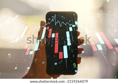 Double exposure of creative abstract global crisis chart with world map hologram and hand with cell phone on background. Financial crisis and recession concept
