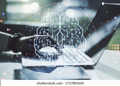Double exposure of creative artificial Intelligence symbol with hands typing on laptop on background. Neural networks and machine learning concept