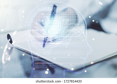 Double exposure of creative artificial Intelligence symbol with man hand writing in notebook on background. Neural networks and machine learning concept