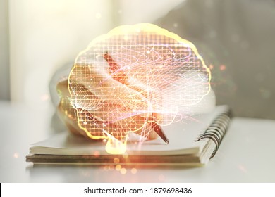 Double exposure of creative artificial Intelligence symbol with man hand writing in notebook on background. Neural networks and machine learning concept