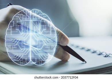 Double exposure of creative artificial Intelligence symbol with man hand writing in notebook on background. Neural networks and machine learning concept