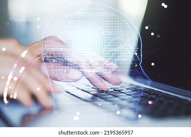 Double exposure of creative artificial Intelligence symbol with hands typing on laptop on background. Neural networks and machine learning concept