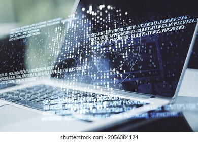 Double exposure of creative code skull hologram on laptop background. Malware and cyber crime concept