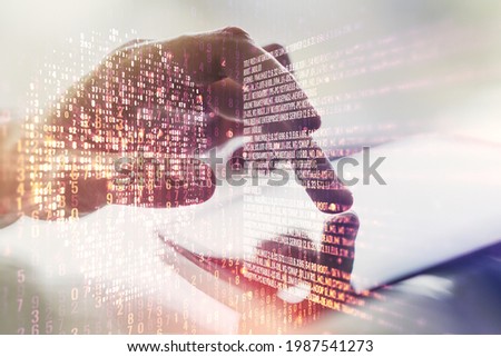 Double exposure of creative code skull hologram and finger clicks on a digital tablet on background. Malware and cyber crime concept