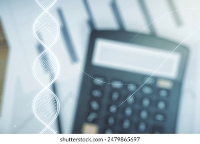 Double exposure of creative DNA hologram on blurry calculator background. Bio Engineering and DNA Research concept - Powered by Shutterstock