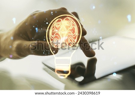 Double exposure of creative light bulb hologram with human brain and with finger clicks on a digital tablet on background, idea and brainstorming concept