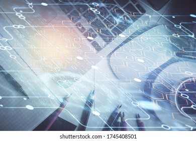 Double exposure of data drawing hologram over topview of study desk background with computer. Concept of Ai. - Shutterstock ID 1745408501