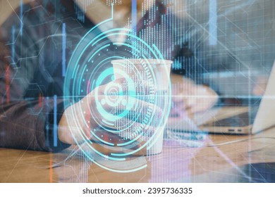 Double exposure of data internet theme hologram with man working on computer on background. Concept of innovation.