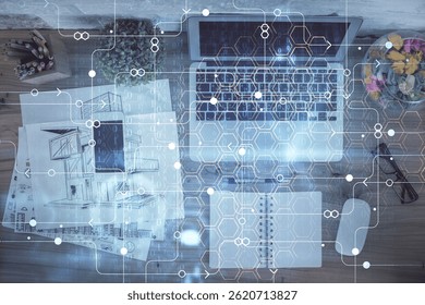 Double exposure of data theme drawing hologram over topview work table background with computer. Concept of technology.