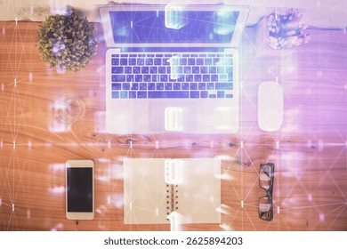 Double exposure of data theme drawing hologram over topview work table background with computer. Concept of technology.