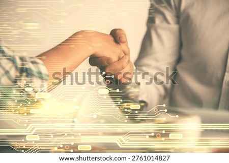 Double exposure of data theme hologram and handshake of two men. Partnership in IT industry concept.
