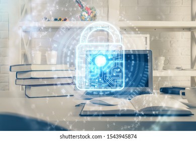 Double exposure of desktop with computer and lock icon hologram. Concept of data safety.