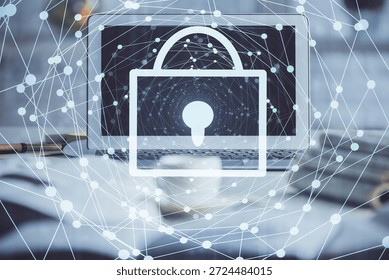 Double exposure of desktop with computer and lock icon hologram. Concept of data safety.