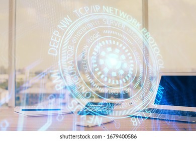Double exposure of desktop computer and technology theme hologram. Concept of software development.