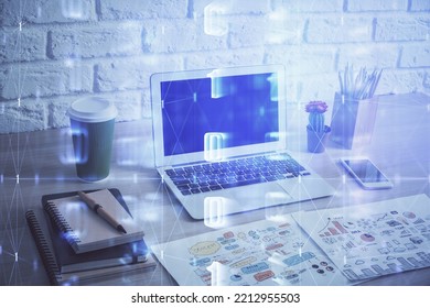 Double exposure of desktop computer and technology theme hologram. Concept of software development.