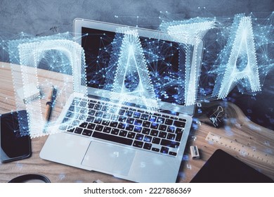Double exposure of desktop computer and technology theme hologram. Concept of software development.