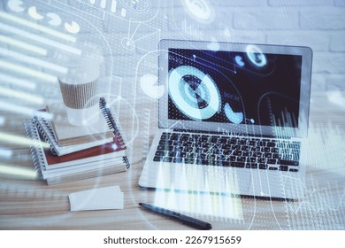 Double exposure of desktop computer and technology theme hologram. Concept of software development.