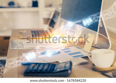 Double exposure of desktop computer and technology theme hologram. Concept of software development.