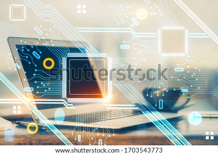 Double exposure of desktop computer and technology theme hologram. Concept of software development.