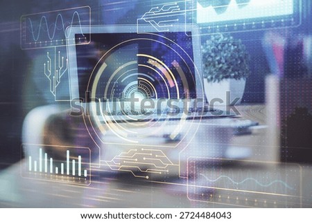 Double exposure of desktop computer and technology theme hologram. Concept of software development.