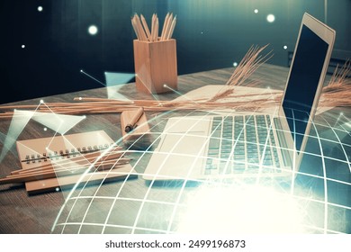 Double exposure of desktop with computer and world map hologram. International data network concept.