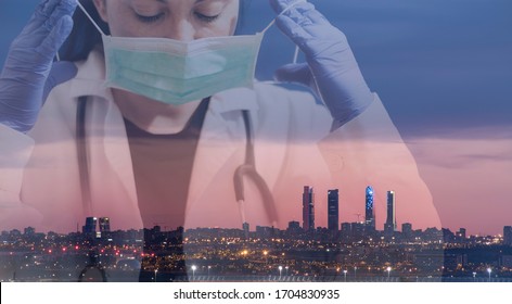 Double Exposure Of A Doctor Holding A Mask With Buildings At The Back Of The Big City, Concept To Health Care And Primary Prevention Of Diseases Such As Coronavirus