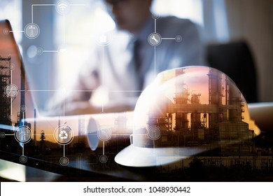 Double exposure of Engineer with oil refinery industry plant background, industrial instruments in the factory and physical system icons concept