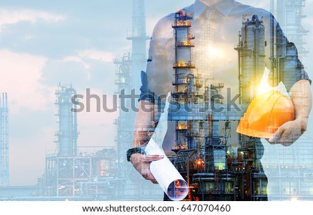 Double exposure of Engineer with safety helmet  with oil refinery industry plant background 