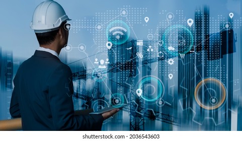 Double Exposure Of Engineering  Hand Using Digital Tablet With Network Connection Interfaces Icon And Construction Cranes Background. Business Technology Industry Concept.