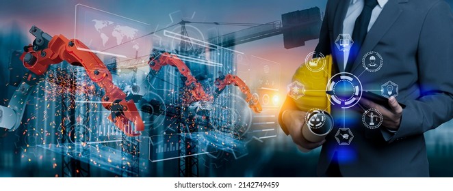 Double exposure engineering team using tablet computer with robotic and digital technology interfaces icon on construction cranes background, Technology and business industrial concept.