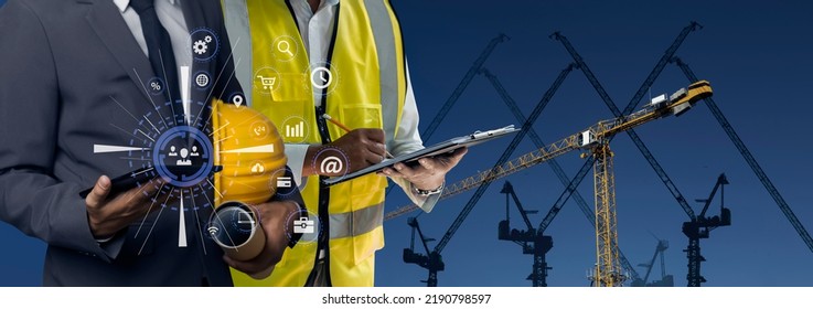 Double exposure engineering team using tablet computer and digital technology interfaces icon on construction cranes background, Technology and business industrial concept.