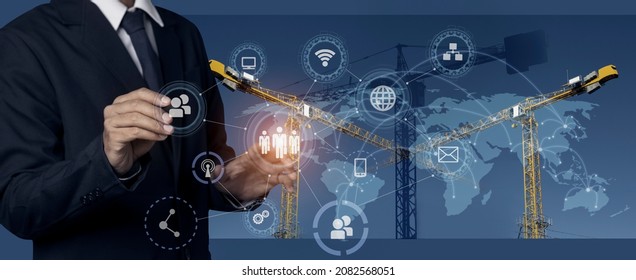 Double exposure of engineering using digital technology innovation interfaces icon with construction cranes blurred background.