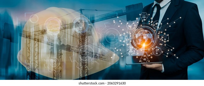Double exposure engineering using tablet computer and digital technology innovation interfaces icons with construction cranes no city background.