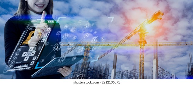 Double Exposure Of Engineering Woman Working With Digital Technology Interfaces Icon And Construction Cranes On City Background, Smart Industry And Digital Technology And IOT Software Concept.