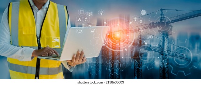 Double exposure engineering working with digital technology interfaces icon and construction cranes on city background, Smart industry and digital technology and IOT software concept.