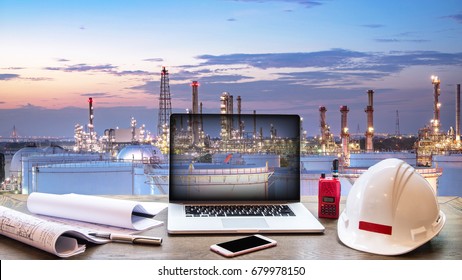 Double exposure Engineers holding safety helmet in arms and holding walk talky in hands with oil and gas refinery background on industry concept - Powered by Shutterstock