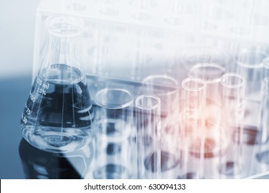double exposure of equipment and science experiments ,Laboratory glassware containing chemical liquid, science research,science background and science concept.