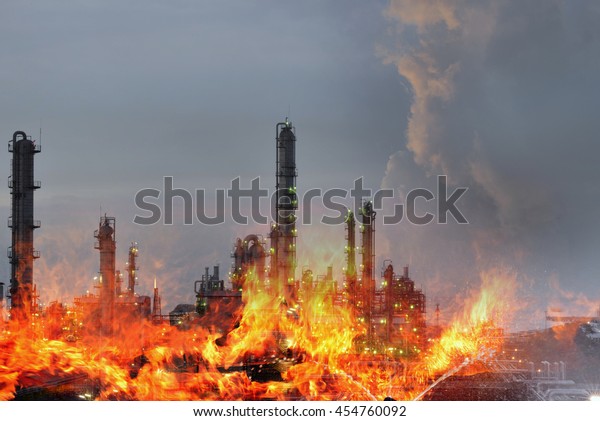Double exposure of\
 Fire and refinery plant  , concept crisis a large oil refinery\
fire and emergency fire\
case.