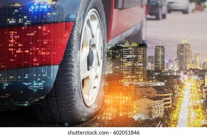 Double Exposure Flat Tire On The Road Waiting For Repair And Cityscape At Night Background.