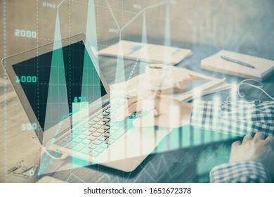 Double exposure of forex chart with man working on computer on background. Concept of market analysis. - Shutterstock ID 1651672378
