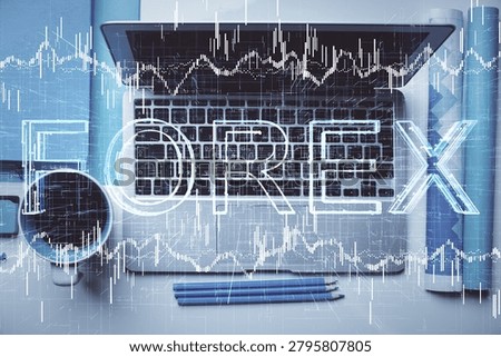 Double exposure of forex graph drawing over desktop background with computer. Concept of financial analysis. Top view.