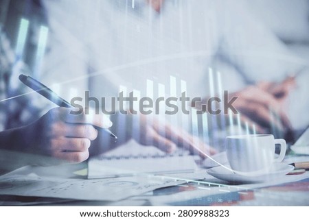 Double exposure of forex graph drawing over people taking notes background. Concept of financial analysis