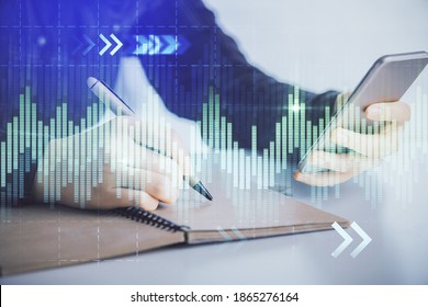 Double Exposure Of Forex Graph Sketch Hologram And Woman Holding And Using A Mobile Device. Stock Market Concept.