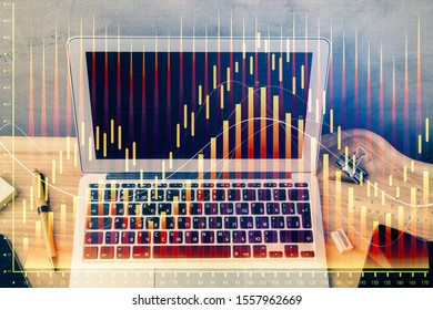 Double exposure of forex graph and work space with computer. Concept of international online trading.