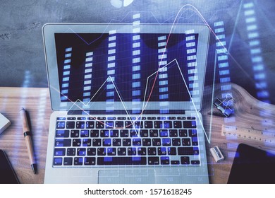 Double exposure of forex graph and work space with computer. Concept of international online trading.