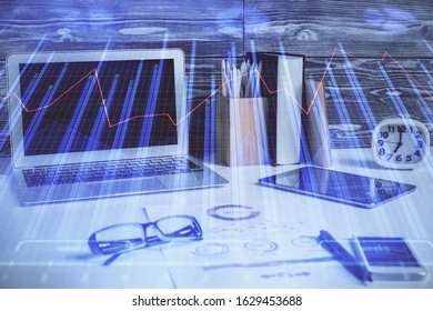 Double exposure of forex graph and work space with computer. Concept of international online trading.