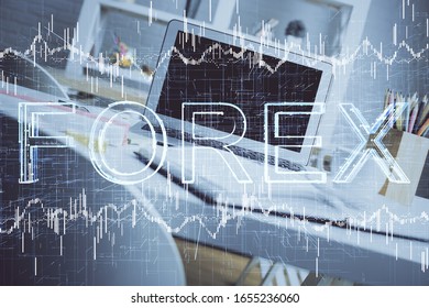 Double exposure of forex graph and work space with computer. Concept of international online trading.