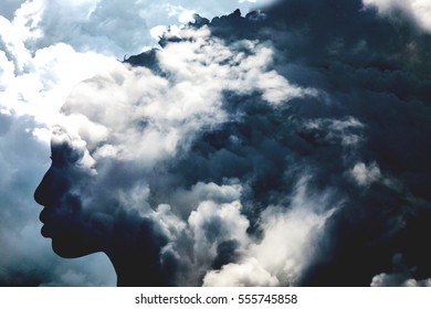 Double Exposure Of Girl Profile Portrait And Stormy Cloudscape